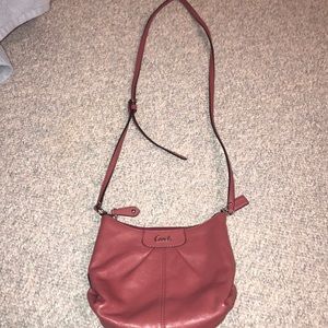a Coach shoulder bag